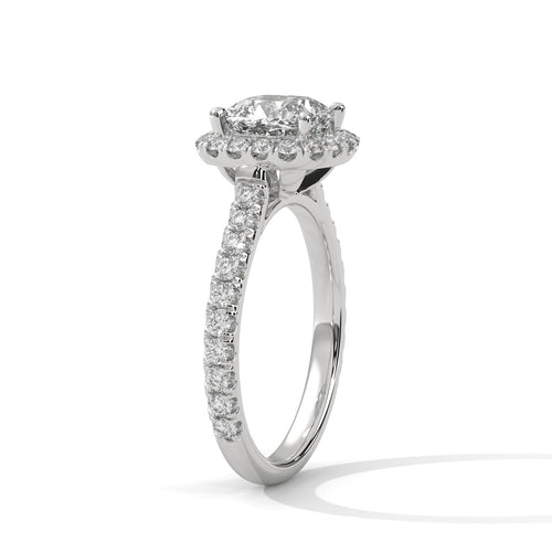 Perspective shot showing the crisp triangular ridge of the white gold knife-edge band and the prominent radiant diamond.
