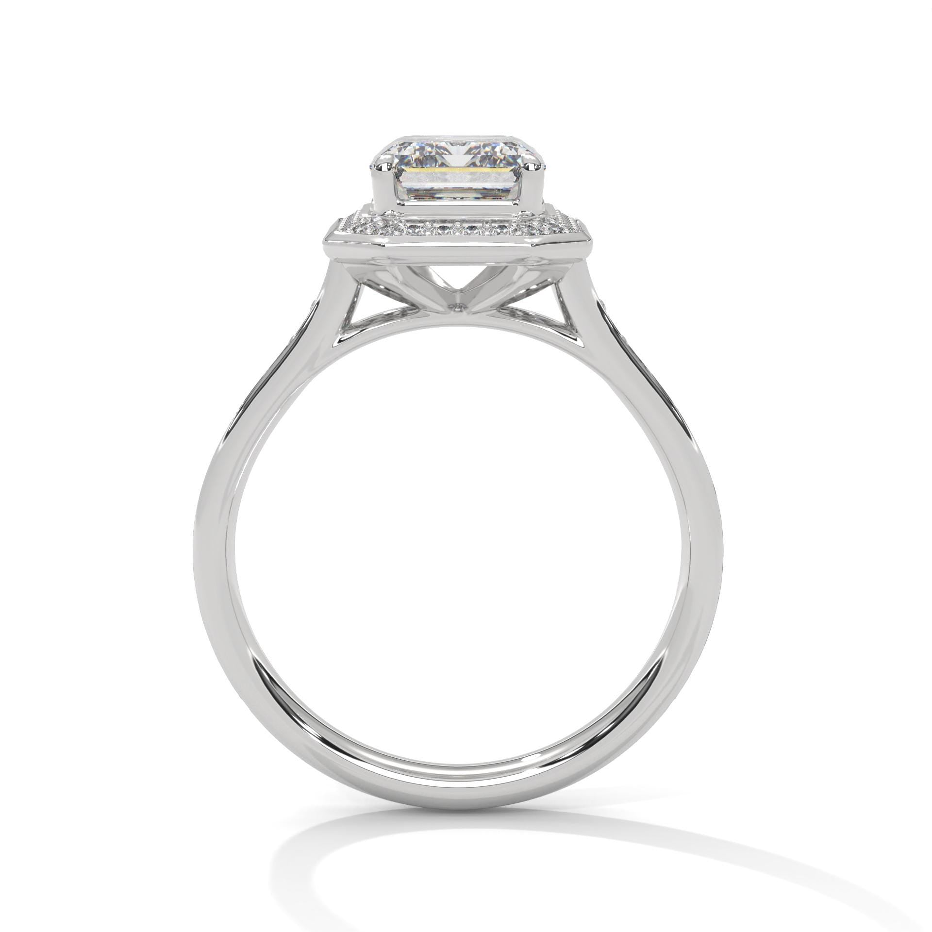White gold emerald halo solitaire with hand-set micro-pavé diamonds