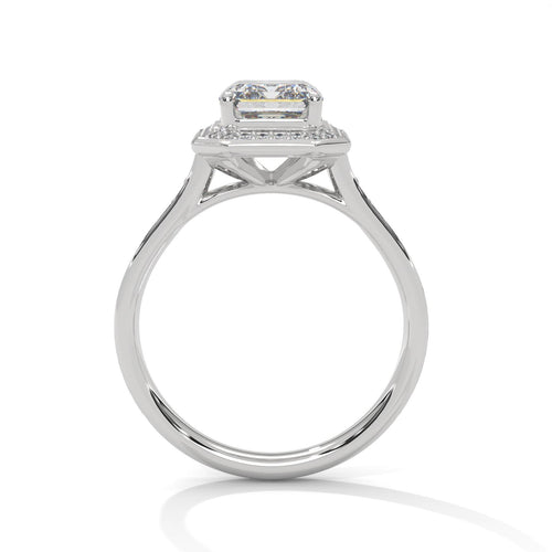 White gold emerald halo solitaire with hand-set micro-pavé diamonds