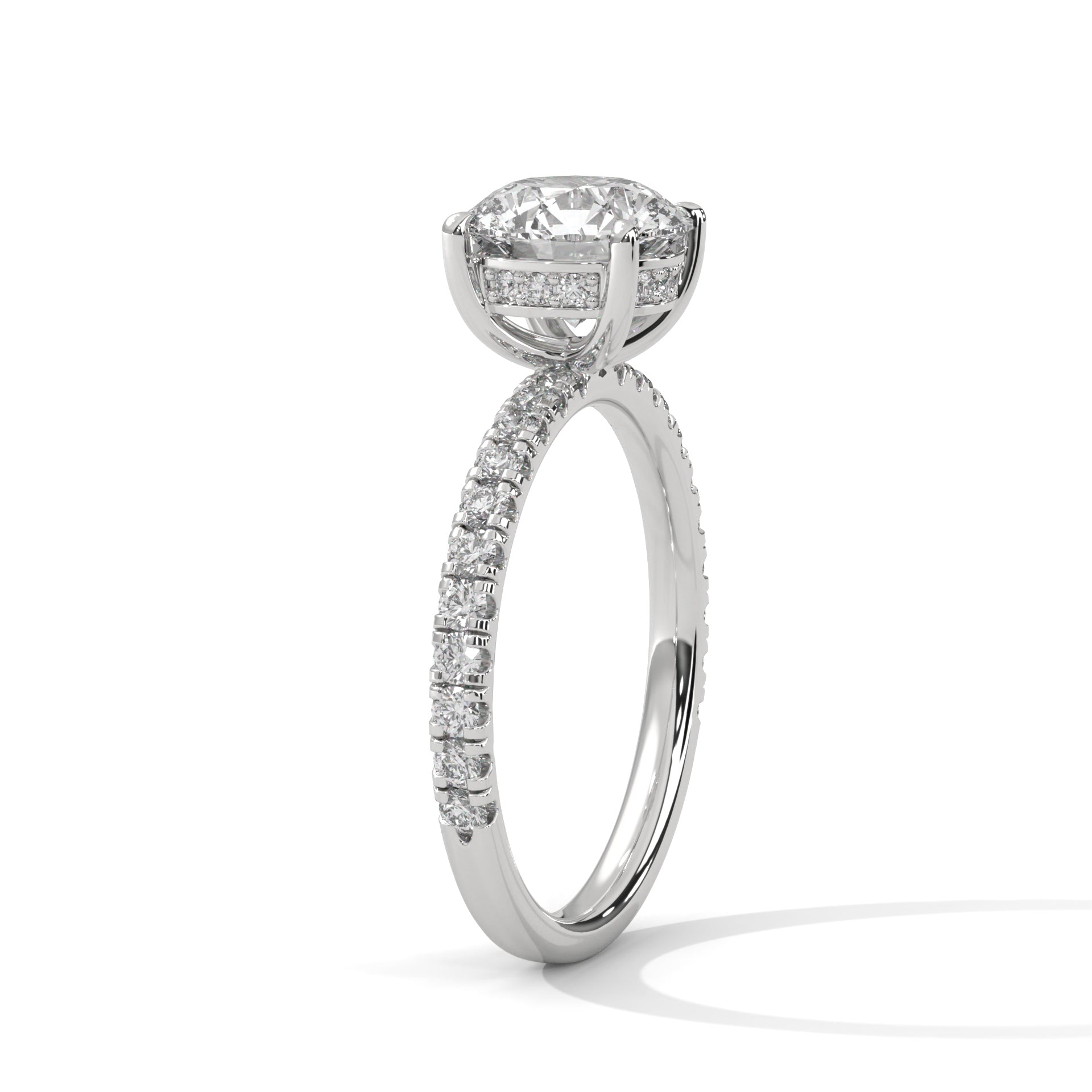 Round brilliant hidden halo pavé engagement ring, angled side view showing band profile