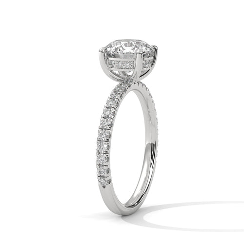 Round brilliant hidden halo pavé engagement ring, angled side view showing band profile