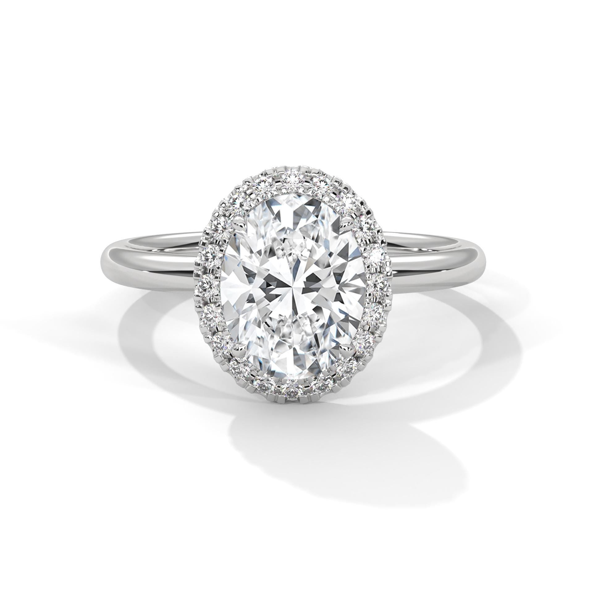 Colorless oval cut lab diamond pave halo ring in white gold