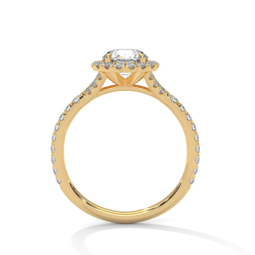 Yellow gold round halo solitaire with hand-set micro-pavé diamonds.