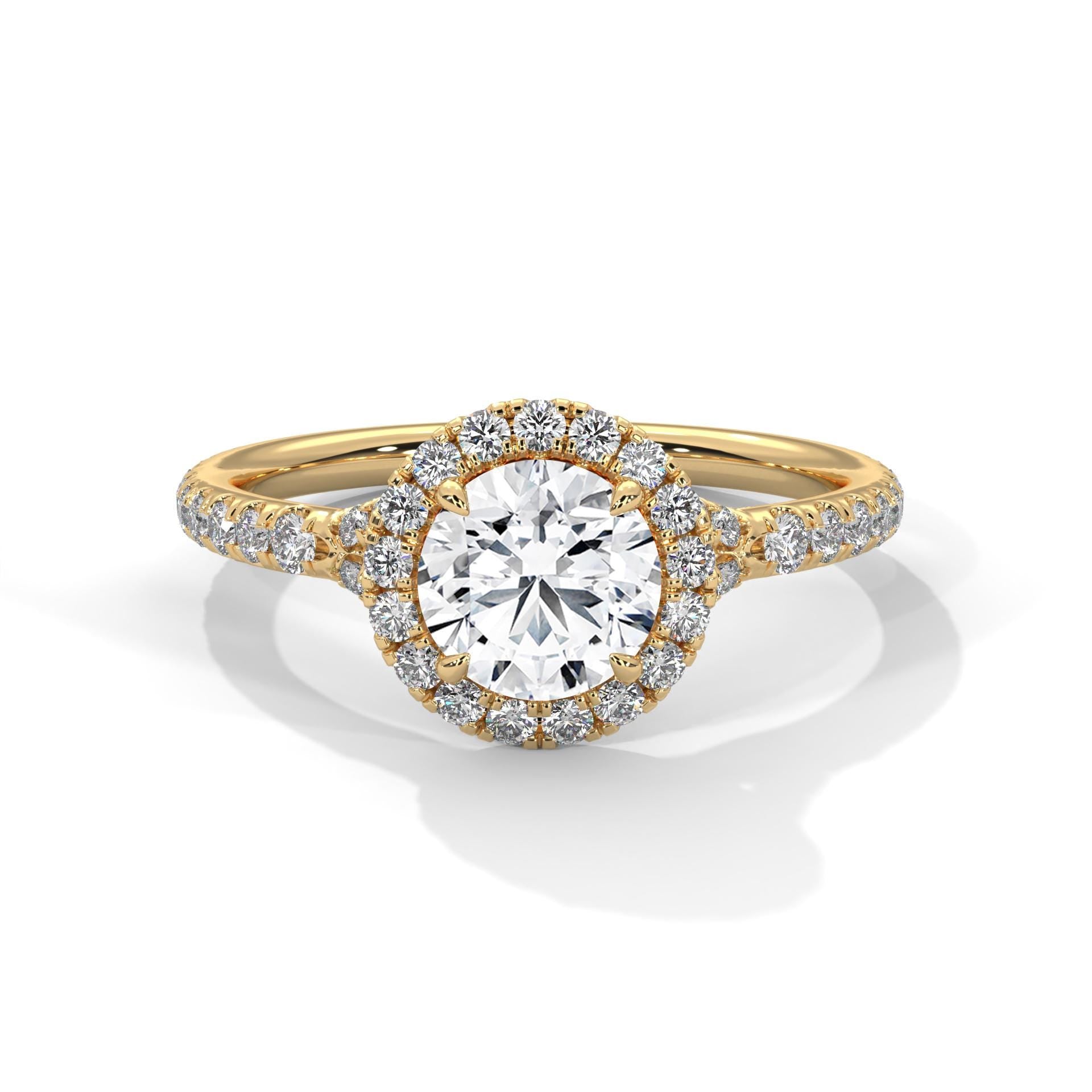 Colorless round cut lab diamond halo ring in 14K yellow gold.
