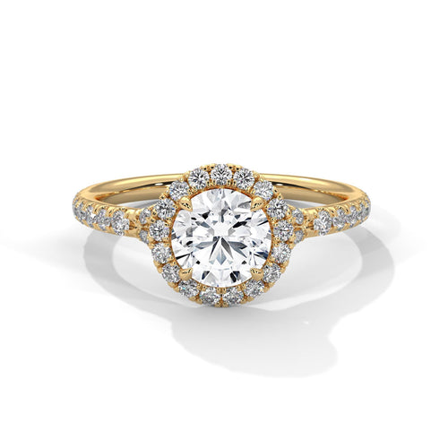 Colorless round cut lab diamond halo ring in 14K yellow gold.