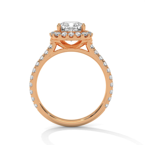 Detailed side view of an architectural four-prong wire basket and integrated hidden halo in polished rose gold.