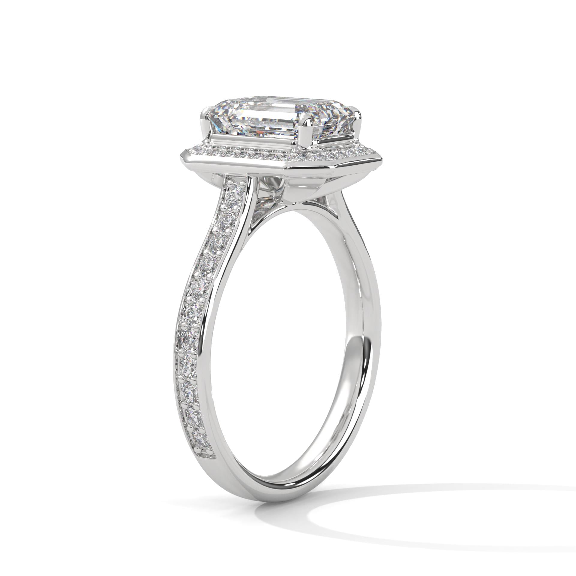 Elevated white gold cathedral mount for emerald lab diamond halo