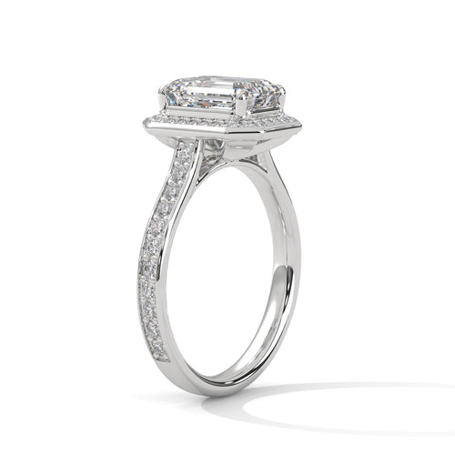 Elevated white gold cathedral mount for emerald lab diamond halo