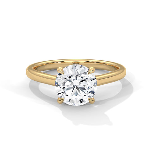 Round brilliant lab grown diamond cathedral solitaire ring in 14K yellow gold.