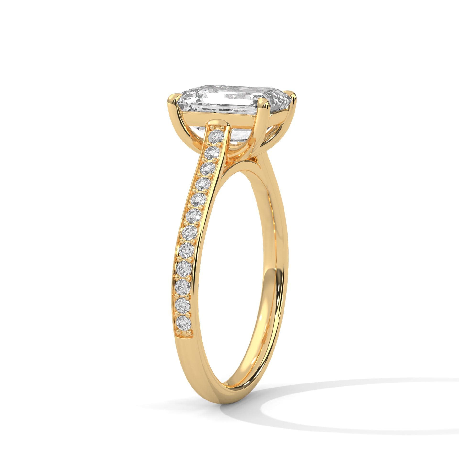 Underside view of yellow gold cathedral arches for emerald brilliant diamond