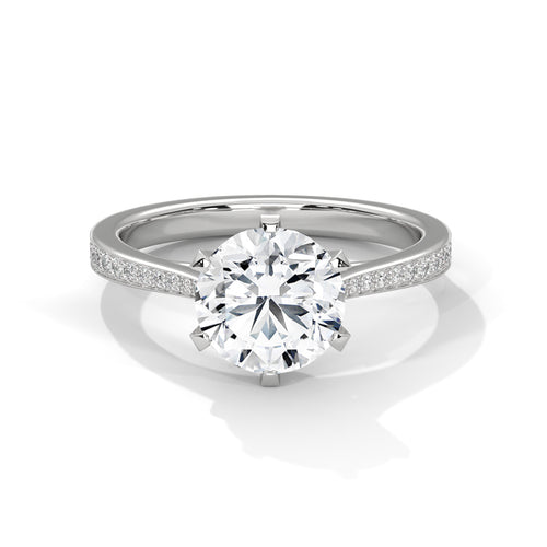 Round brilliant lab-grown diamond engagement ring with a pavé-set diamond band in solid white gold.