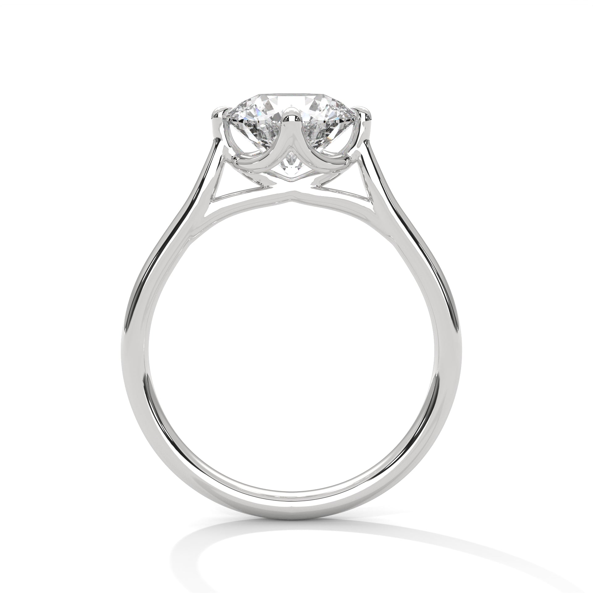 Close-up of a classic round brilliant solitaire engagement ring in white gold worn on a finger.