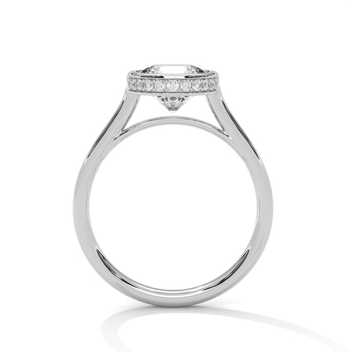 Side view of a circular bezel setting supported by sleek white gold cathedral arches.