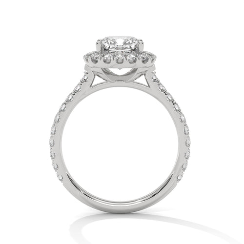Side view of a four-prong setting with a subtle hidden halo and an open V-gallery wire basket in polished white gold.