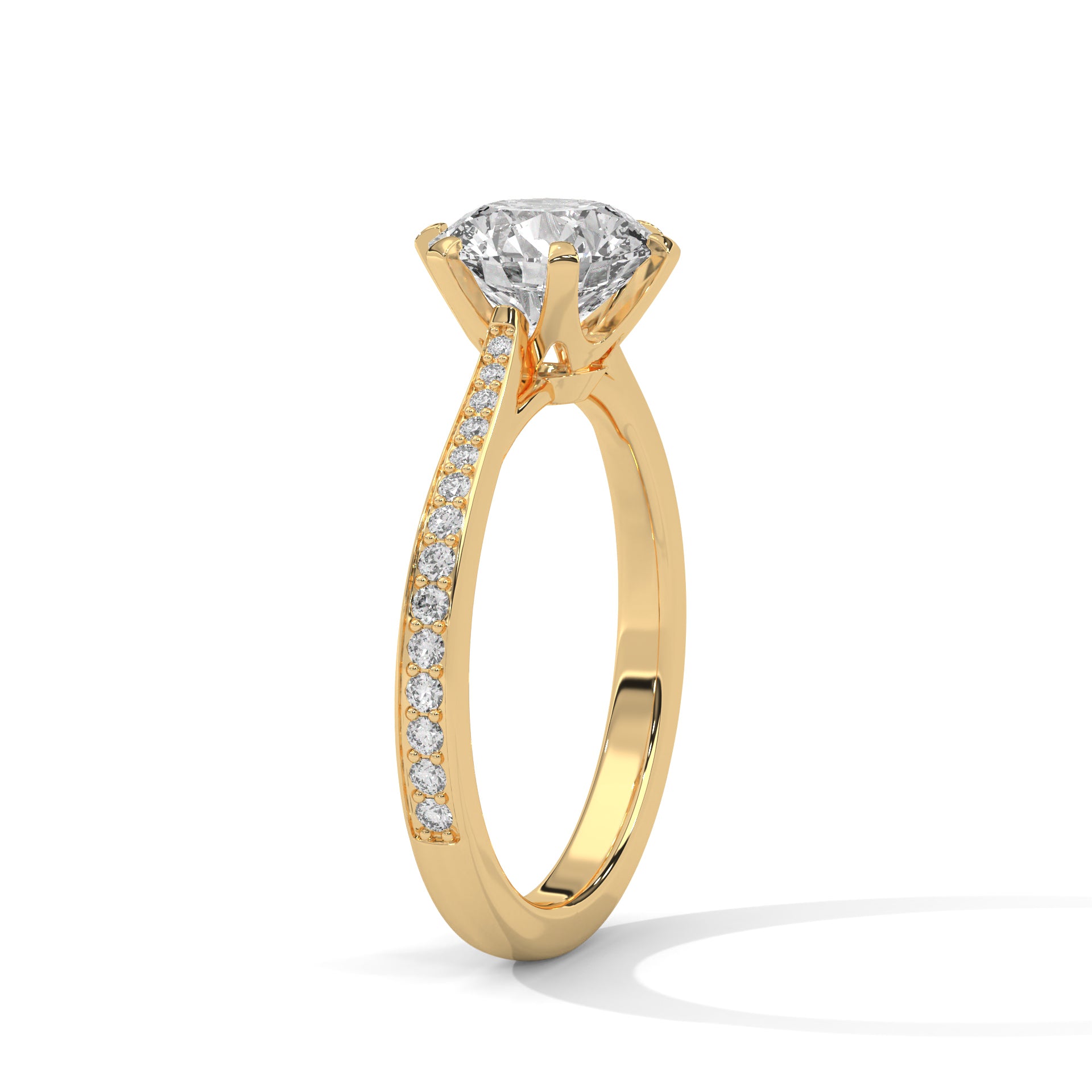 Angled perspective of a round diamond engagement ring in yellow gold showcasing the pavé band.