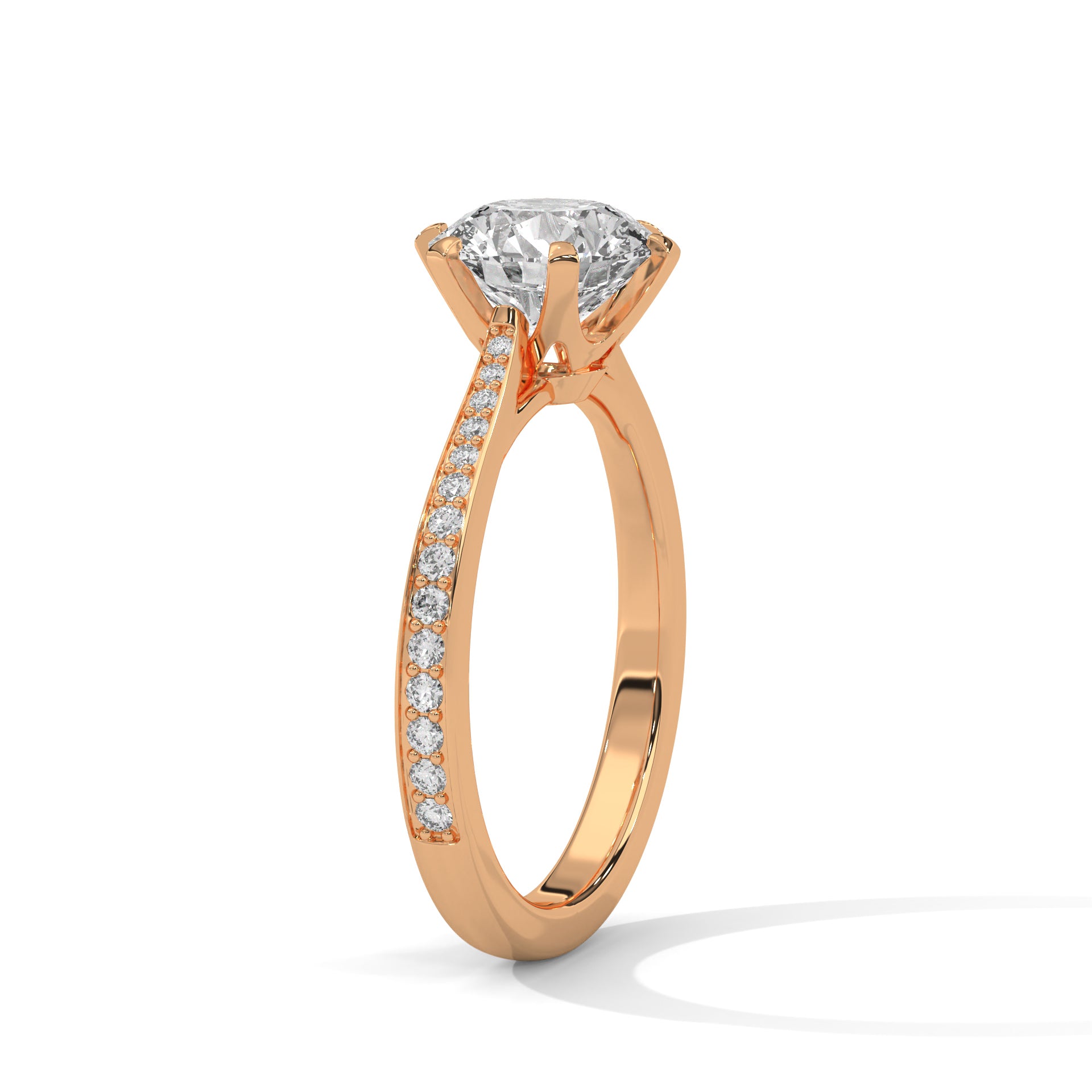 Detailed angled shot of a round diamond and pavé band in rose gold.