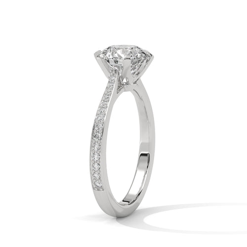 Perspective shot showing the pavé diamond band and six-prong mount in white gold.