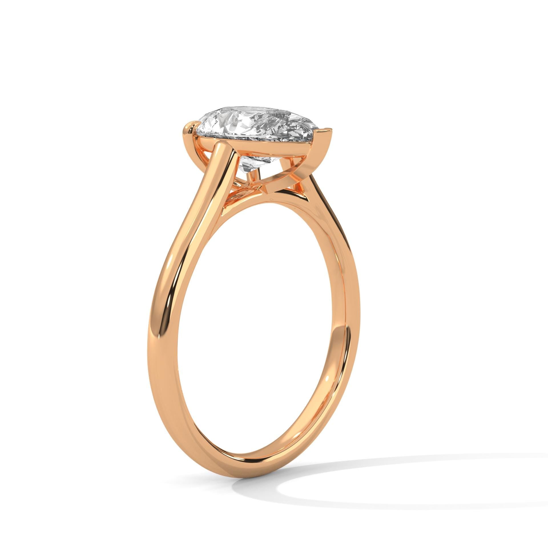 Teardrop diamond engagement ring with high-polish rose gold band