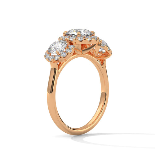 Underside view of rose gold cathedral mount for three-stone halo diamond ring