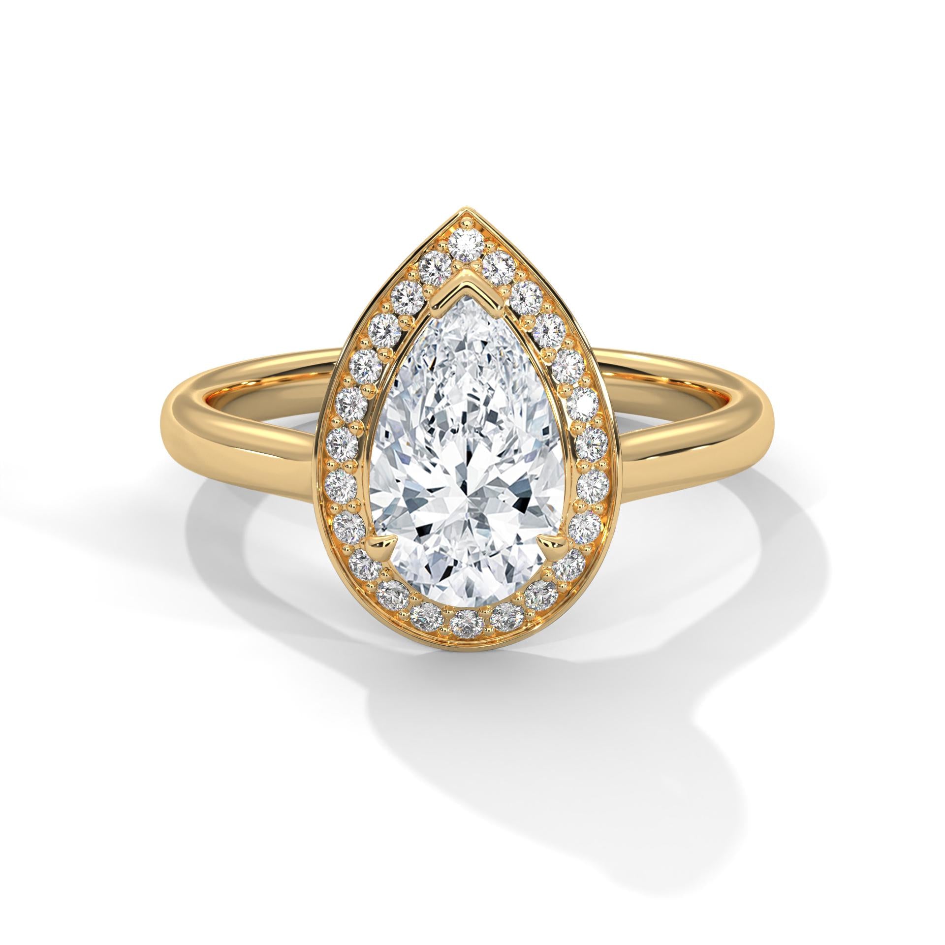 Colorless pear cut lab diamond halo cathedral ring in 14K yellow gold