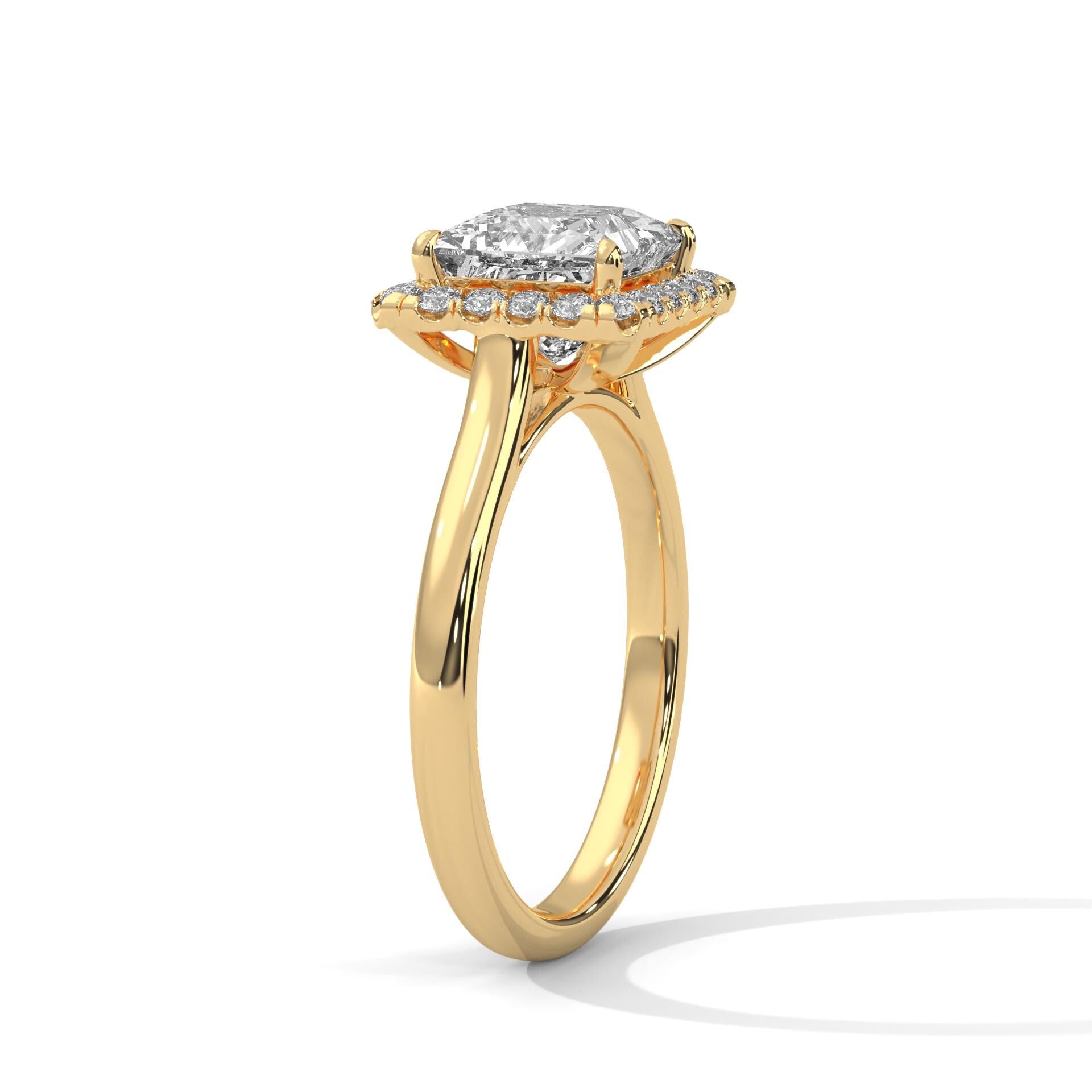 Underside view of yellow gold halo setting for princess brilliant diamond