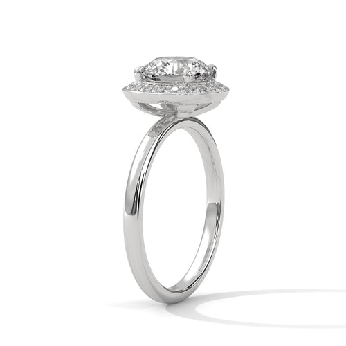 White gold round halo solitaire with a radiant diamond-set border