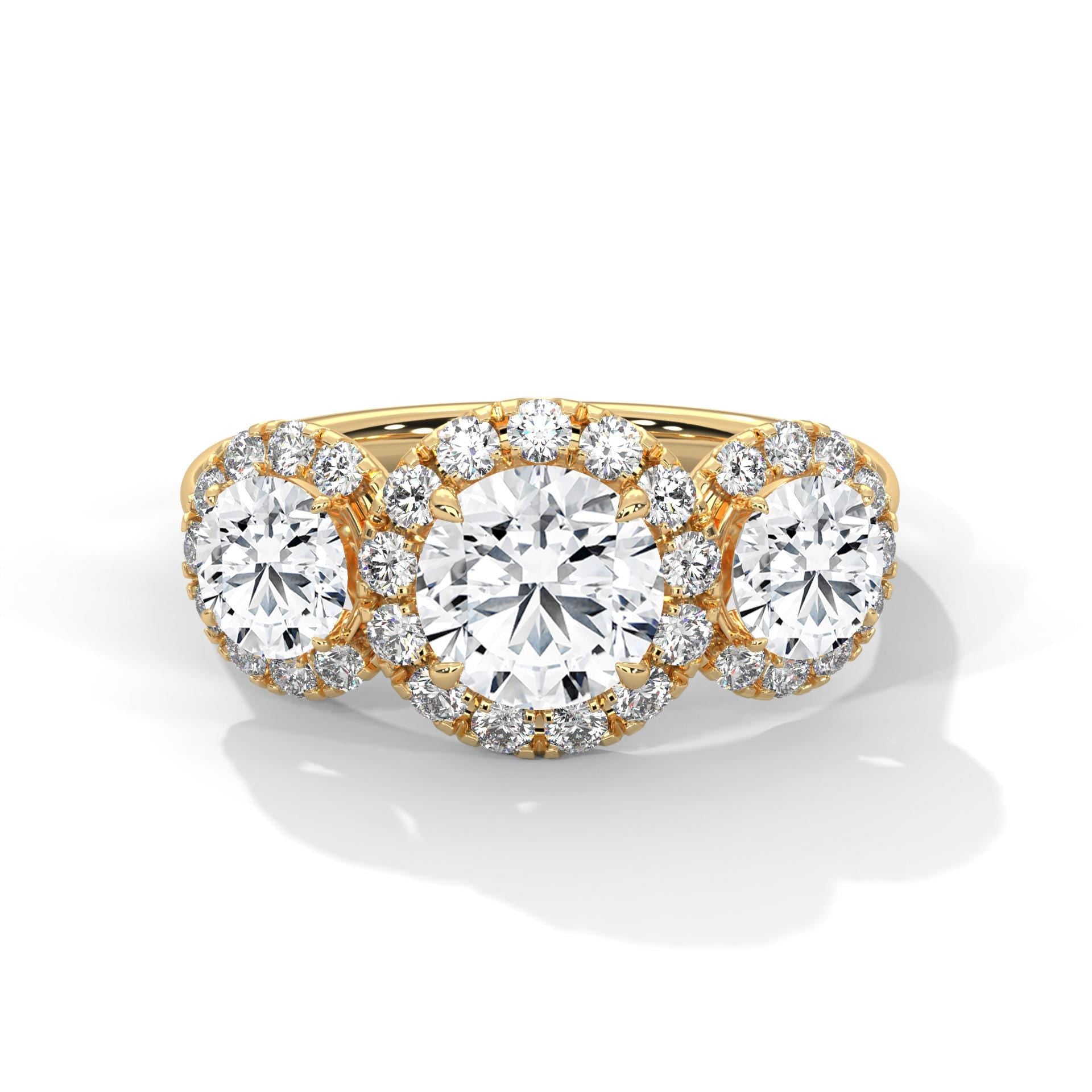 Three-stone round lab grown diamond halo engagement ring in yellow gold