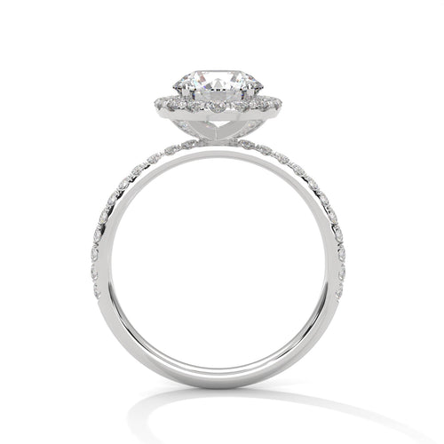 Side view of white gold round halo ring showing high-profile cathedral lift
