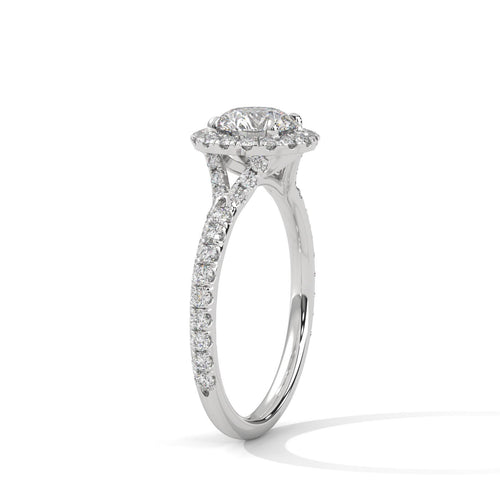 Architectural white gold 4-prong halo setting for round brilliant diamond