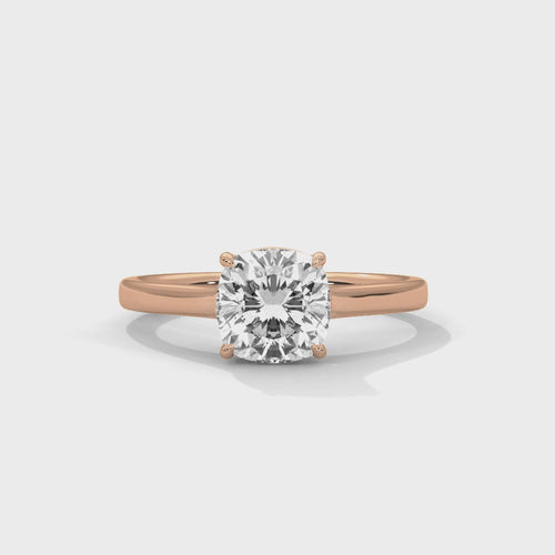 High-definition video showcasing the crisp lines of the knife-edge band, the 360-degree light entry from the open V-gallery, and the fire of the cushion cut lab-grown diamond.