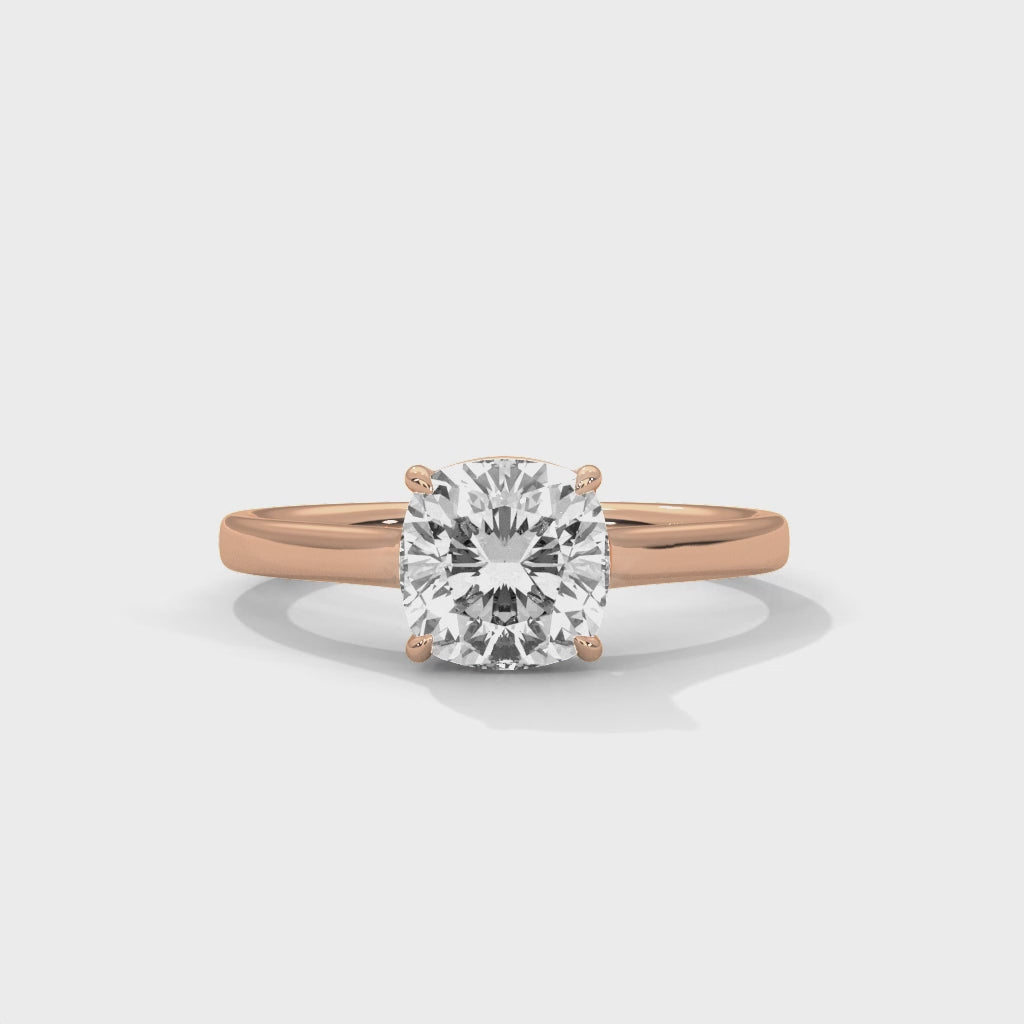 High-definition video showcasing the crisp lines of the knife-edge band, the 360-degree light entry from the open V-gallery, and the fire of the cushion cut lab-grown diamond.