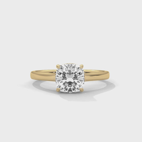 High-definition video showcasing the crisp lines of the knife-edge band, the 360-degree light entry from the open V-gallery, and the fire of the cushion cut lab-grown diamond.