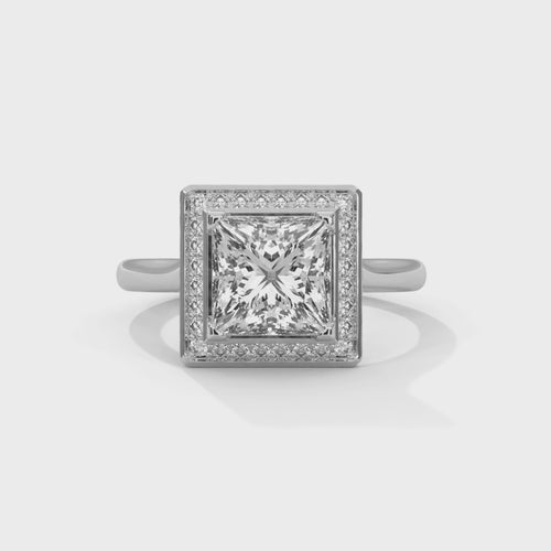 Princess cut elevated square halo engagement ring in white gold, overhead view of princess cut stone and square halo setting