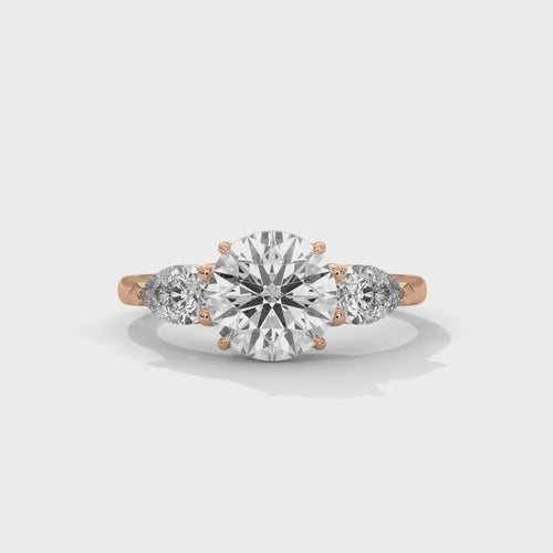 Video showcasing the light performance and sparkle of a three-stone lab-grown diamond engagement ring.