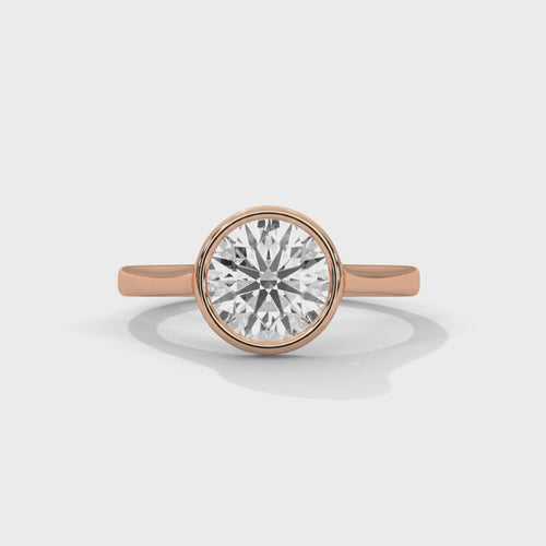 High-definition video showing the modern silhouette, architectural tapered band, and smooth bezel border of the lab-grown diamond solitaire ring.