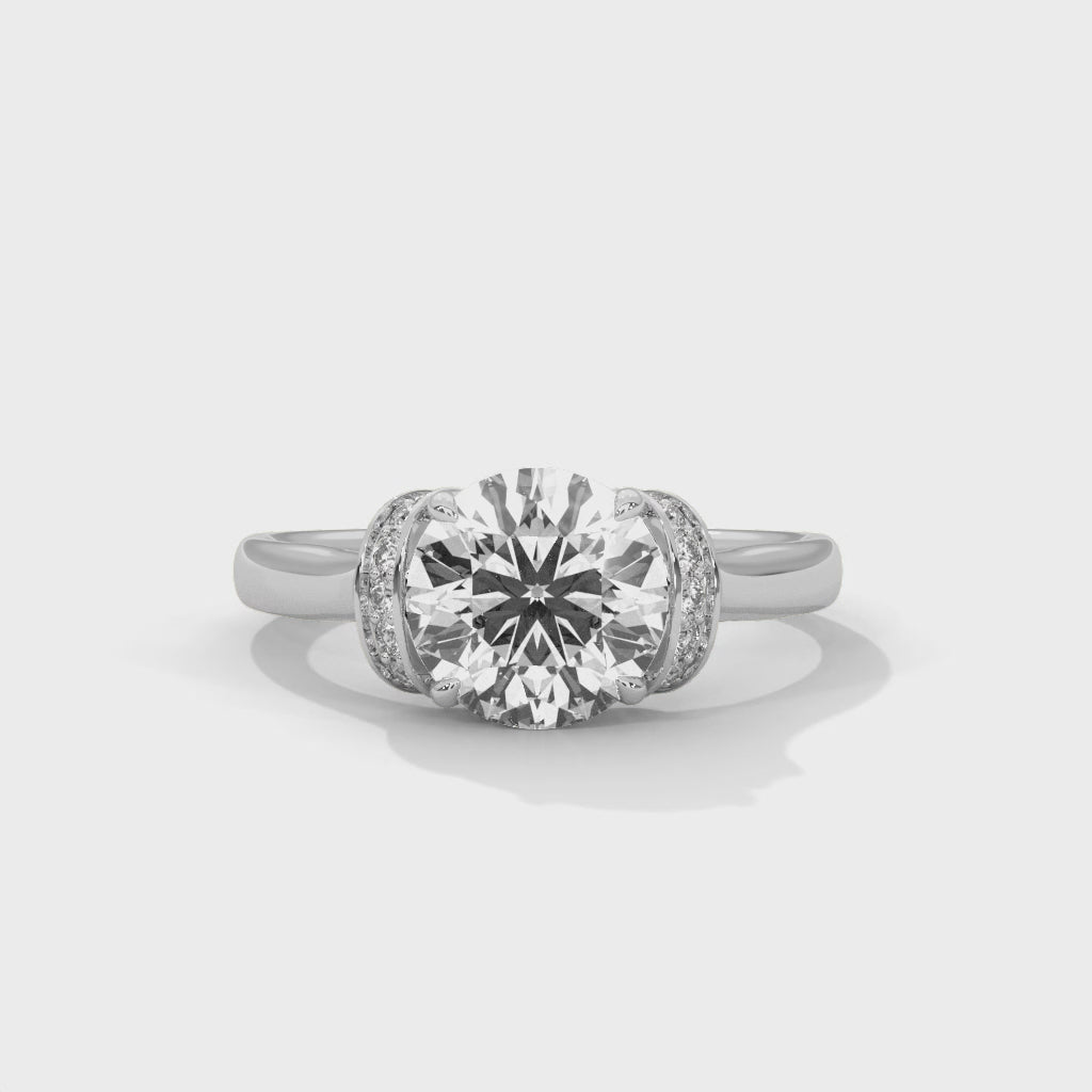 Video display showing the 360-degree sparkle and hidden halo detail of a round brilliant lab-grown diamond ring.