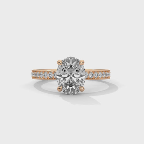 Oval hidden halo micropavé engagement ring, top-down view of oval center stone and micropavé halo setting