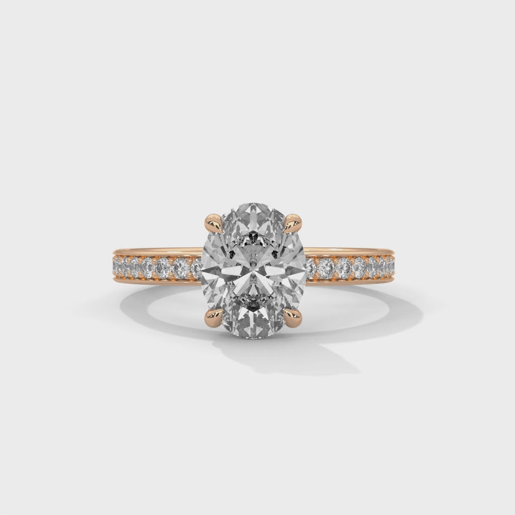 Oval hidden halo micropavé engagement ring, top-down view of oval center stone and micropavé halo setting