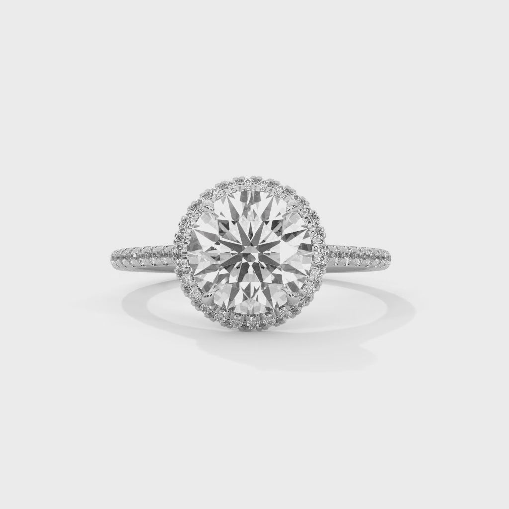 High-definition video showcasing the fire and 360-degree light performance of a round brilliant lab-grown diamond halo ring.