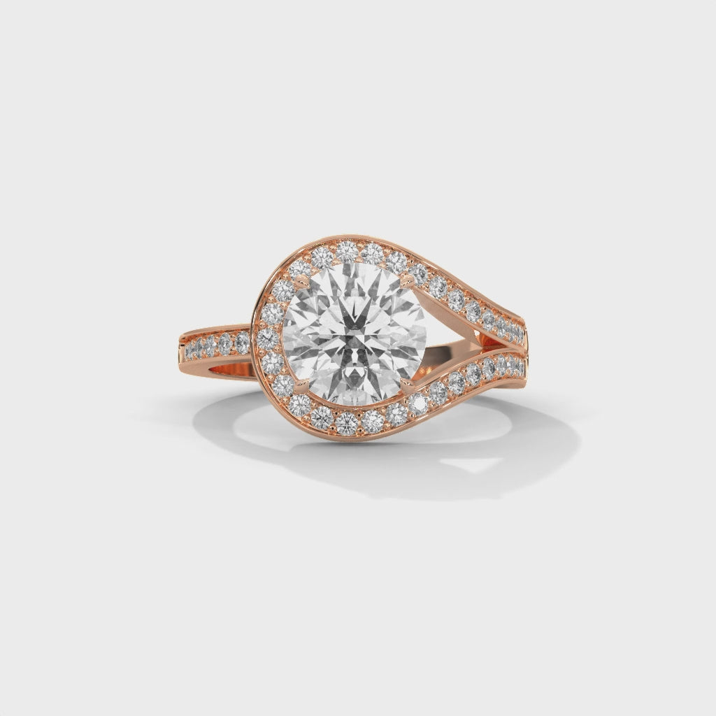 Round brilliant bypass split halo engagement ring in rose gold, top-down view of round brilliant stone and bypass split halo