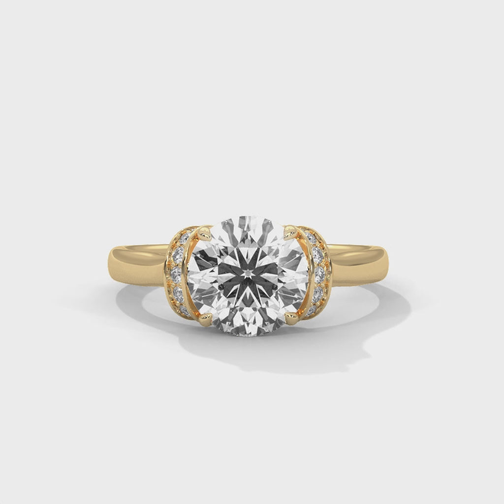 Video display showing the 360-degree sparkle and hidden halo detail of a round brilliant lab-grown diamond ring.