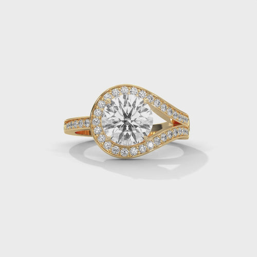 Round brilliant bypass split halo engagement ring in yellow gold, close-up angled view of bypass halo and split pavé shank