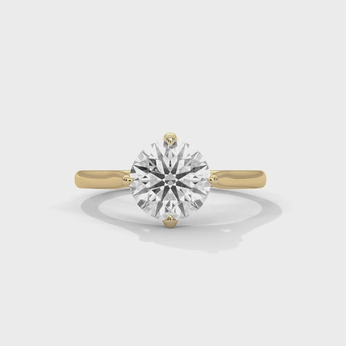 Cinematic video showcasing the 360-degree brilliance and fire of a round brilliant lab-grown diamond solitaire ring.