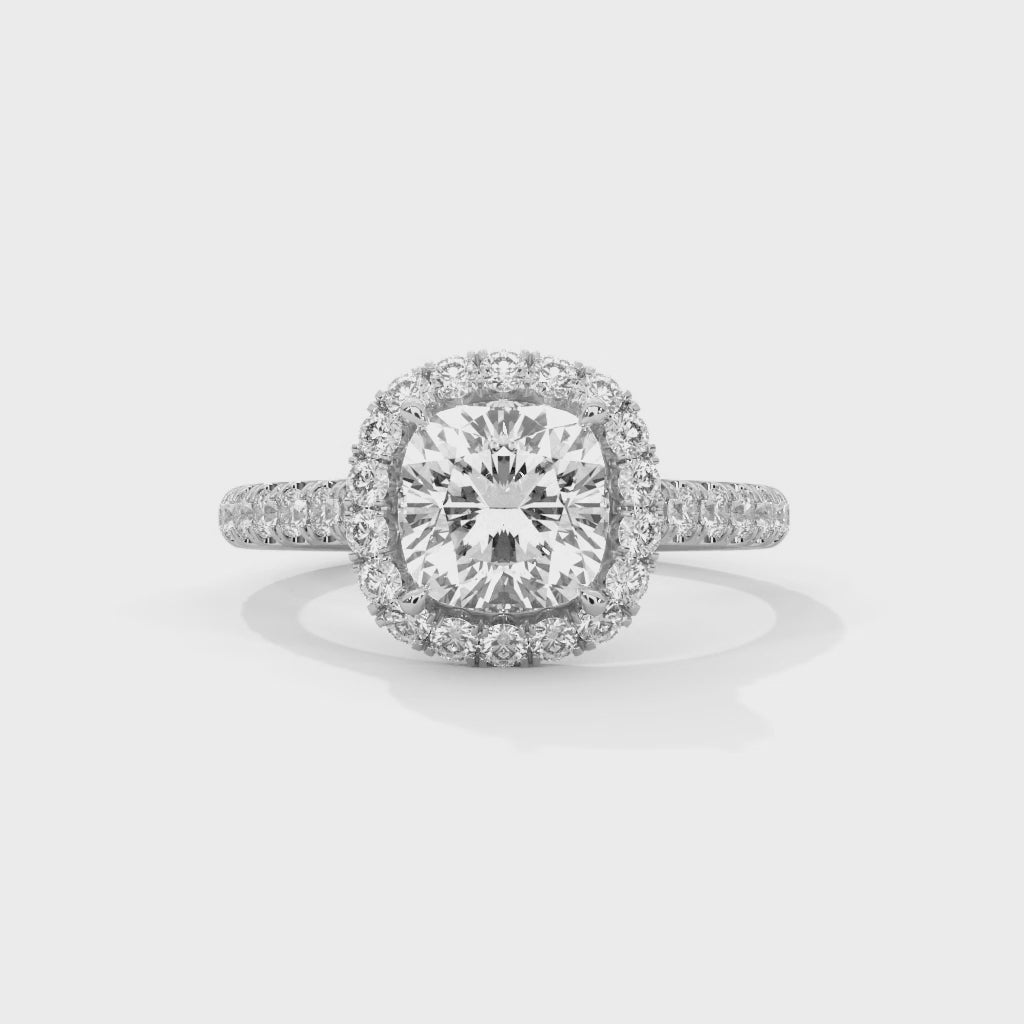 High-definition video showcasing the split light performance of the knife-edge band, the discreet sparkle of the hidden under-halo, and the fire of the radiant cut lab-grown diamond.